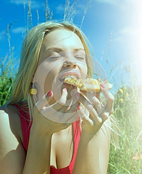 Girl eats pizza.basket lunch