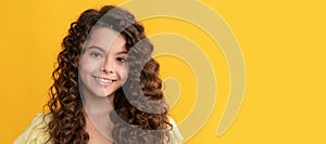nice girl has wavy hairdo. portrait of frizz child. express positive emotion. Child face, horizontal poster, teenager