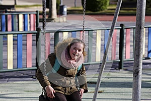 Nice girl having fun on the playgound