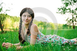 Nice girl posing on the grass