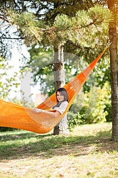 Nice girl resting in hammock