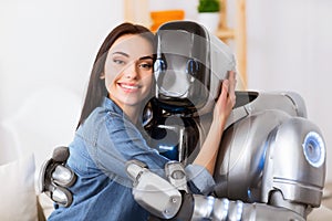 Nice girl and robot embracing