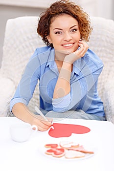 Nice girl sitting at the table