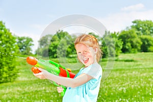 Nice girl with a water gun