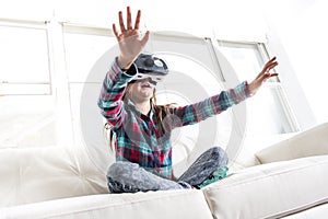 Girl wearing virtual reality goggles photo