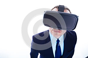 Nice handsome man using virtual reality glasses