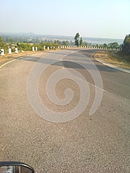 A nice highway between mountain and forest