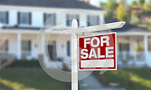 Nice Home For Sale Real Estate Sign in Front of Beautiful New House.