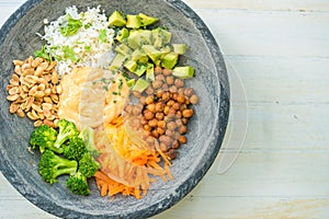 Nice image of a fresh salad on a wooden table.