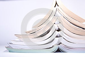 Nice image of a pile of old books on a white background.