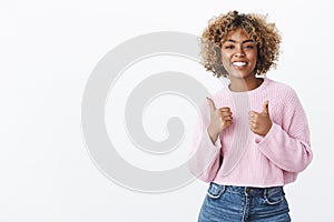 Nice job, cool result. Portrait of friendly-looking delighted attractive joyful african american woman with blond curly