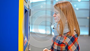 Nice Lady is Buying a Ticket in Vending Machine, Paying by Credit Card Paypass
