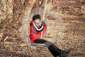 Nice lady on a country swing on a cold day in Idaho