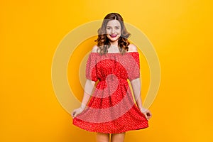 Nice lady showing new outfit ready for birthday party wear off-shoulders dress isolated yellow background