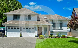 Nice lawn and entrance of beautiful residential house on sunny day