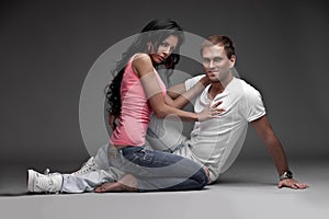 Nice likeable guy with girl on gray background photo