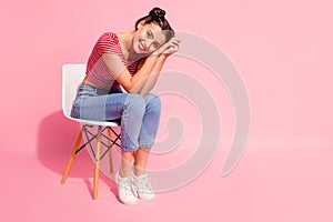 Nice-looking cute sweet attractive glamorous winsome lovely shine cheerful girl wearing striped tshirt jeans sitting on