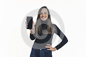 nice-looking young woman smiling and showing phone screen to the camera, medium shot isolated studio shot