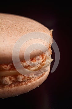 Nice macaroon on black background