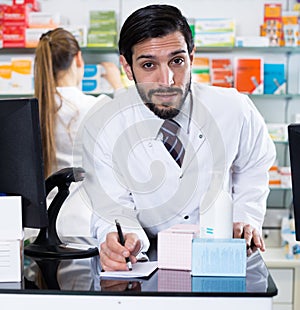 Nice male is stocktaking medicines with computer