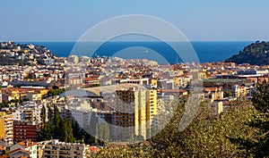 Nice metropolitan view with Colline du Chateau Castle Hill, Mont Boron Mountain, Vielle Ville, Riquier and Port district in France