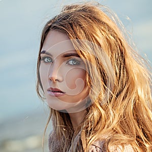 Nice Model Girl with Long Curly Woman with Windy Blowing Hair