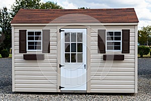 a nice new gray storage shed