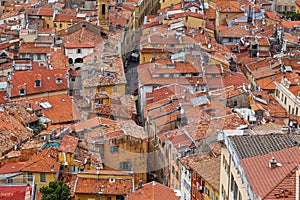 Nice old town, French Riviera, France. View from above to the city rooftops and narrow streets.