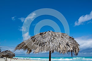 Nice palapas on a Cuban beach by a sunny day