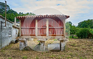 Nice photo with a hÃÂ³rreo, which is a construction designed to store and preserve food away from moisture and animals to keep it photo