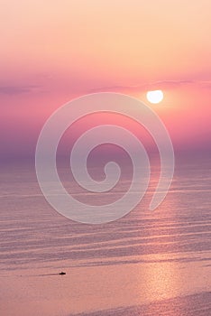 Nice pink sunset seascape in pastel shades, peace and calm outdoor travel background