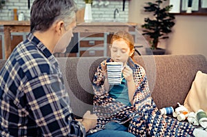 Nice pleasant girl holding a tea cup