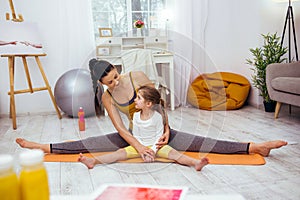 Nice positive girl learning to do the splits