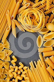 Nice postcard, background for the menu - italian traditional fettuccine pasta nests on a gray background