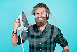 nice quality. home domestic duties. mature brutal hipster use modern technology. household concept. guy ironing