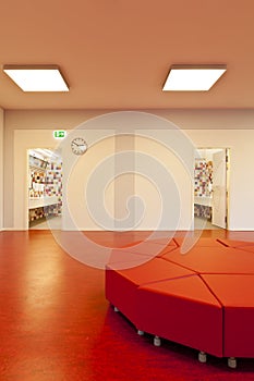 Nice school. Interior of a school hall with red floors.