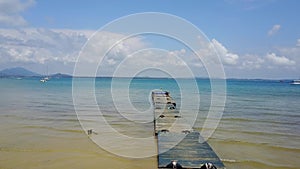 Nice sea and wooden pier with Blue sky,Thailand Sea