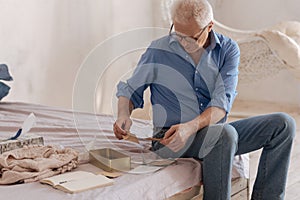 Nice senior man checking his old mail