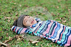 Nice smile of little girl when relax lie down