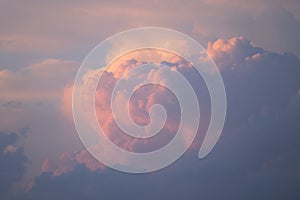 Pink clouds at the sunset in summer