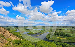 Nice summer landscape with hill slope over delta river