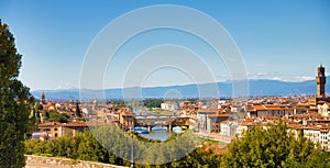 Nice sunny skyline of Florence. Arno river and Ponte Vecchio panorama of Florence. Panoramic view of famous Ponte Vecchio with