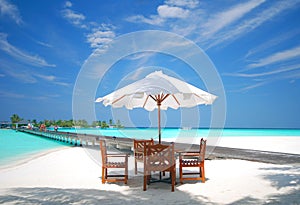 Nice table on the white sands of a Maldives island