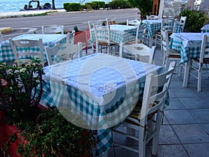 Nice tables and chairs at the restaurant await guests photo
