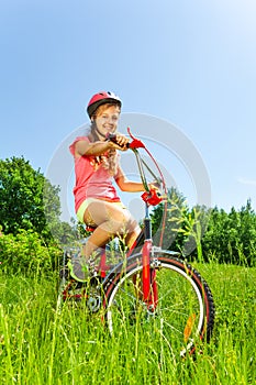 Nice teenage girl on bicycle