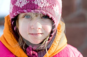 Nice toddler girl in winter pink hat