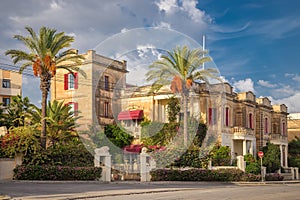 Nice traditional building at Valletta with palm trees - Malta
