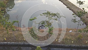 A nice view of street beside some ponds.