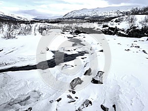 Nice winterlandscape with the bridge, which is crossing the Stoja River near to Maurvangen - Jotunheim - Norway