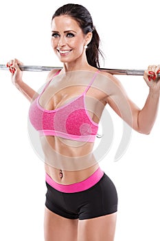Nice woman doing squat workout with big dumbbell, retouched